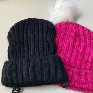 Pink and black two pack knit cap with pompom unattached